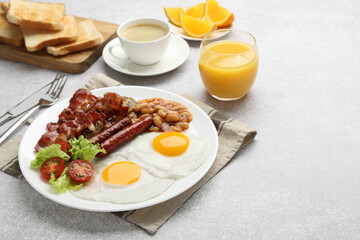 Delicious breakfast with sunny side up eggs on light table. Space for text