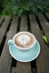 chocolate cup on brown grunge wooden table outdoor drinking