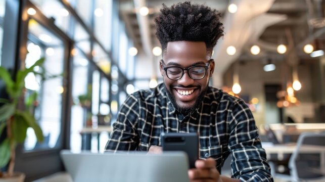 Man Smiling at Smartphone Screen