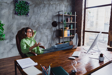 Photo of charming lovely woman customer support manager listening speech sitting in modern office...