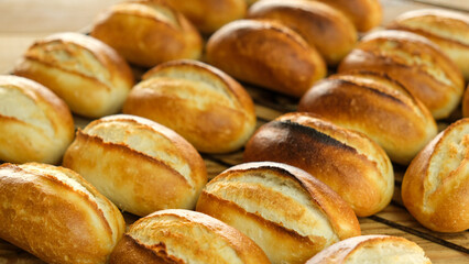Close up fresh small baked bread isolated background. 