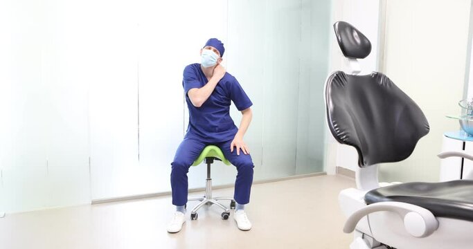 Sitting dentist, dealing with arm pain.Symptoms and self help exercises, stretching. Front view.