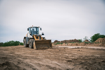 there is a large excavator on a building site