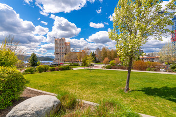 Sunny day at the lakefront McEuen Park in downtown Coeur d'Alene, Idaho, with the lake, marina, and resort in view.