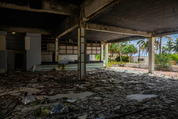 A beautiful abandoned hotel. Interiors of an abandoned hotel on the beach. Sunny day. Shabby walls.