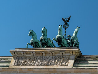 The famous Quadriga statue located on the historical Brandenburger Tor. Close-up high-resolution photo of the Brandenburger Tor and Qaudriga statue, symbols of Germany and Europe.