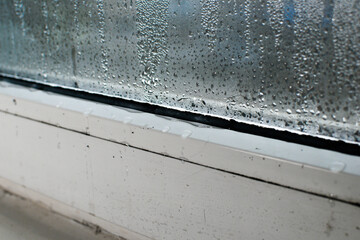 a wet window. water droplets on the glass