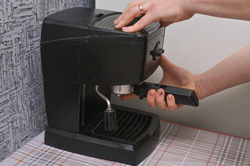 preparing the coffee machine for brewing coffee