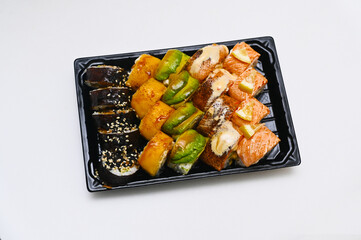 different sushi rolls on a white background