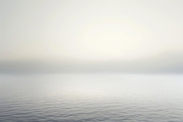 Obraz premium Minimalist gradient background blending soft gray to white, providing a neutral and versatile backdrop for various applications
