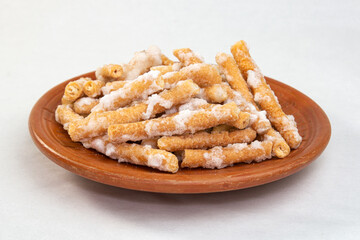 sweet Goja. A Sweet Snack Treat at tea time. sugar coating dry crispy Sweet. Conamonar Thang or Murali. deep fried and soaked in sugar syrup. Popular Bengali Baisakhi mela or festive food.