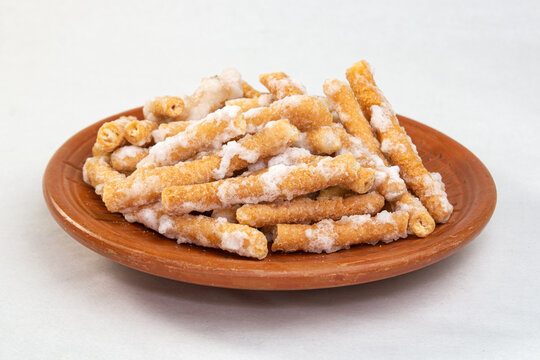 sweet Goja. A Sweet Snack Treat at tea time. sugar coating dry crispy Sweet. Conamonar Thang or Murali. deep fried and soaked in sugar syrup. Popular Bengali Baisakhi mela or festive food.