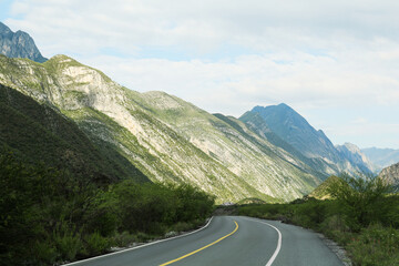 Fototapeta premium Empty asphalt road in mountains. Picturesque landscape