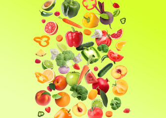 Different fresh fruits and vegetables in air on light green background