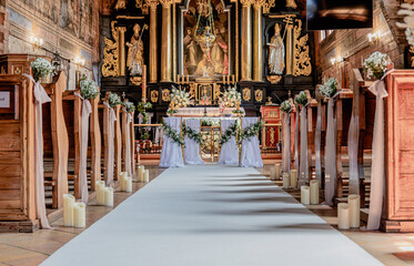 Wedding decorations in a Catholic church. Wedding decorations