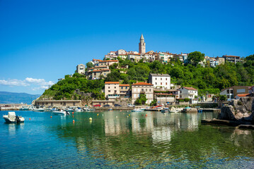vrbnik, croatia, 29 april 2028, view
from a bay to the old town on the coast