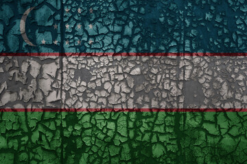 flag of uzbekistan on a old grunge metal rusty cracked wall background