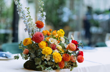 Wedding and festive decor in yellow, orange, red colors. bright decor on the table. wedding feast