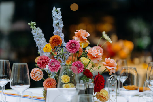 Wedding and festive decor in yellow, orange, red colors. bright decor on the table. wedding feast