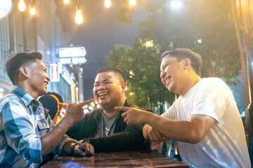 Three Friends Laughing and Bonding at Outdoor Cafe. Friendship bonding concept