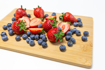 Red ripe strawberry background, close-up, front view, top view, strawberry plate with white background,