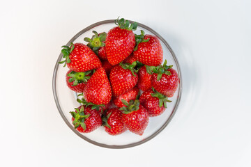 Red ripe strawberry background, close-up, front view, top view, strawberry plate with white background,