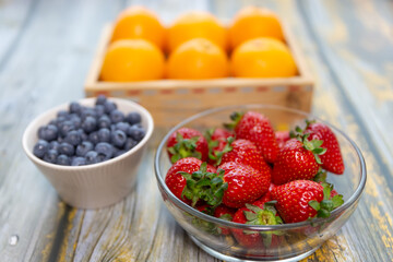 Red ripe strawberry background, close-up, front view, top view, strawberry plate with wood floor background,