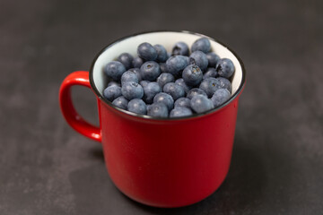 Blueberries isolated on black background, close-up, front view, top view,