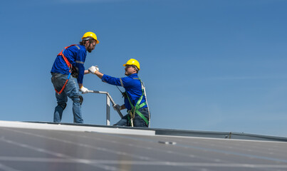 Solar roof engineer men working on factory roof 
