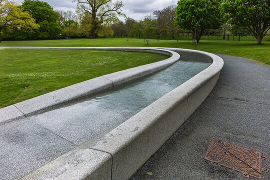 Diana Memorial Fountain is located south of the Serpentine Lake (designed by Gustafson Porte, 2004). London, UK. April 19, 2024.