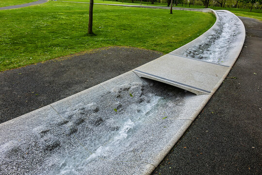 Diana Memorial Fountain is located south of the Serpentine Lake (designed by Gustafson Porte, 2004). London, UK. April 19, 2024.