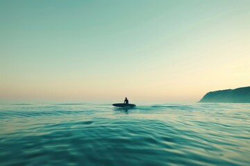 Fototapeta premium A person on a surfboard in the middle of the ocean. Suitable for travel and sports concepts