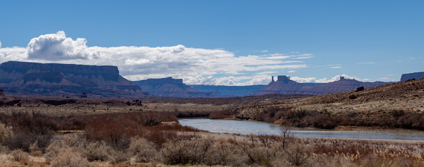 Panoramic Blue skies and Red Cliffs of Utah's Castle Valley with the Colorado River Below in Spring