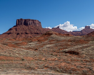 Red cliff and butte landscapes in Utah Castle Valley with blue skies in spring 