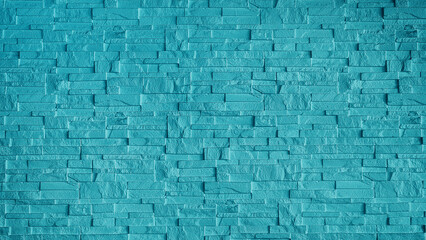 stone cladding wall made of regular light blue bricks. abstract wall panels for decoration, background and texture. blue wall made from grunge stone material for modern style decoration.
