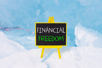 Financial freedom symbol. Concept words Financial freedom on beautiful yellow black blackboard....