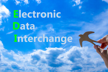 EDI electronic data interchange symbol. Concept words EDI electronic data interchange on blue sky...