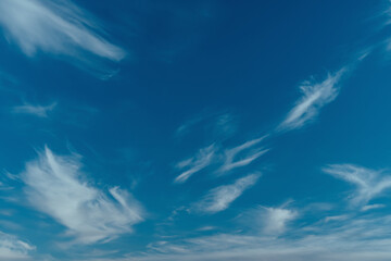 Fluffy clouds on blue sky background