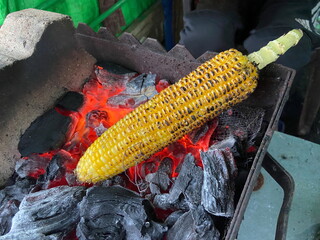 Roasted sweetcorn marinated with spice and salt.