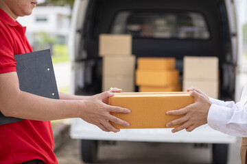 SME business operator is inspecting and packing products into parcel box for delivery company that...