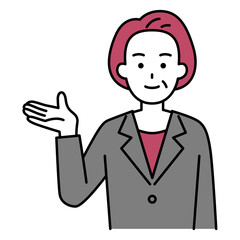 右手で案内する年配のスーツの女性