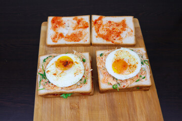 A Golden-Yolk Fried Egg Sandwich on Toast for a Delightfully Savory Breakfast. Designed to Elevate Your Morning Rituals with Delightfully Savory Flavor and Nourishing Satisfaction