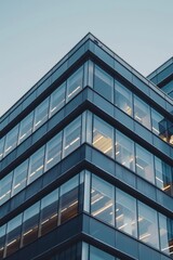 Obraz premium A tall building with numerous windows and a clock. Suitable for urban architecture concepts