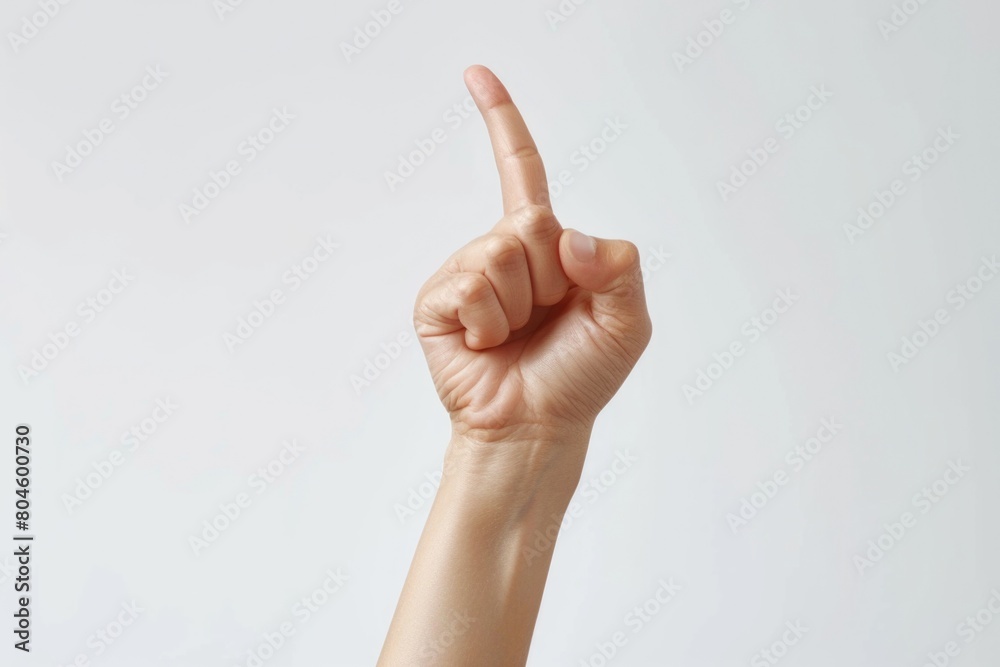 Poster a person's hand with a finger up in the air. suitable for various concepts and ideas