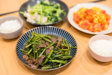 Asian family dinner with fry egg and beed with vegetable at home