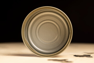 an open round can for canning on a wooden table