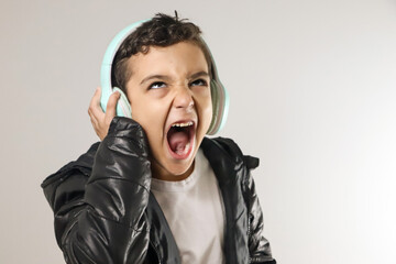 boy listening to music with headphones