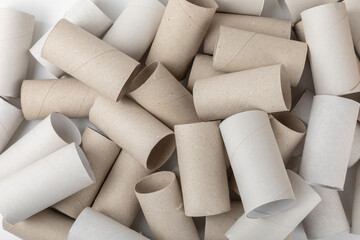 Empty toilet paper roll. Rolls of toilet paper on background. Paper tube of toilet paper. Place for text. Copy space. Flat lay. Eco-friendly reuse recycle