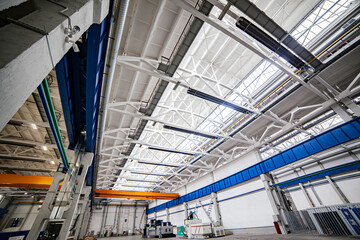 the factory interior , a modern light metalworking hangar warehouse with equipment
