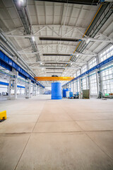 the factory interior , a modern light metalworking hangar warehouse with equipment